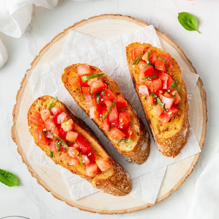 Gourmet bruschetta made with high-quality imported ingredients, representing the authentic specialty foods now available in Florida and North Carolina.
